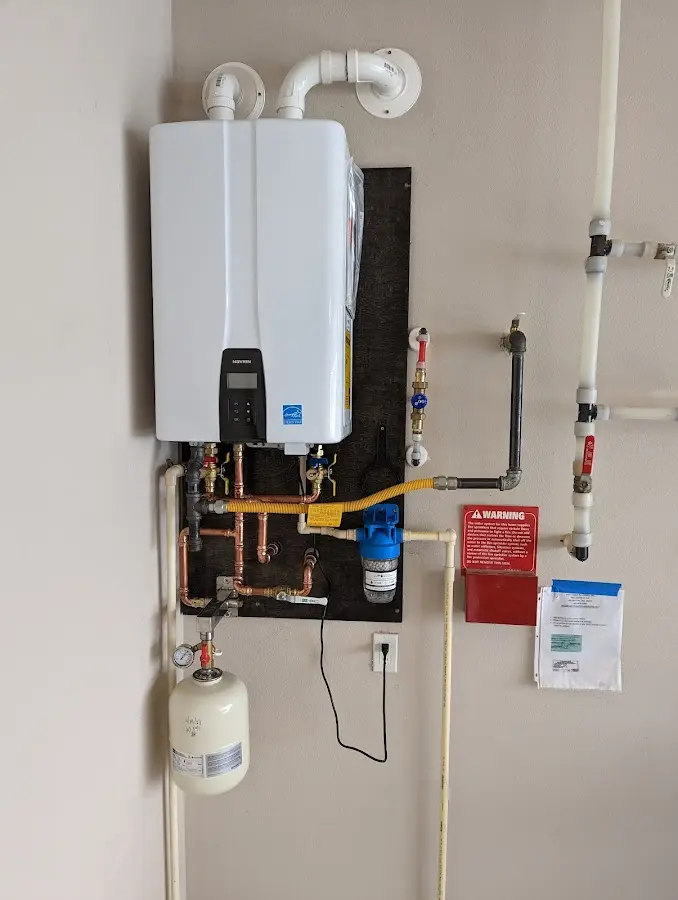 Professional plumber installing copper piping in a Central Gardens home